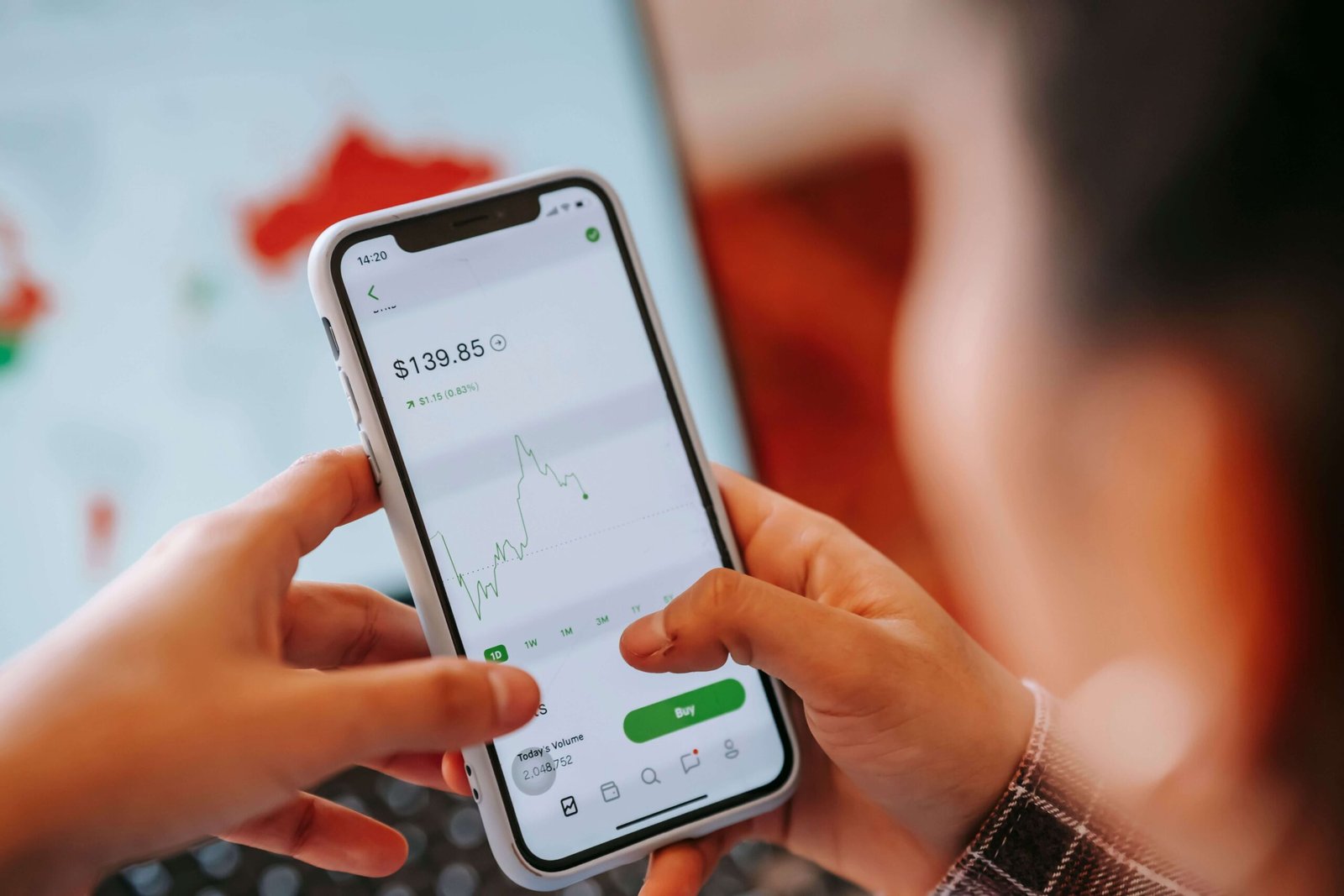 Beginner investor reviewing financial documents and market research